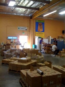 Folks sorting food for the hungry at food bank Folks sorting food at food bank