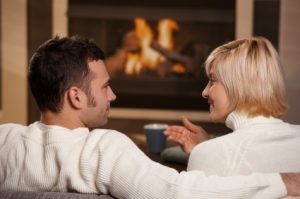 Cozy couple by the hearth, new home