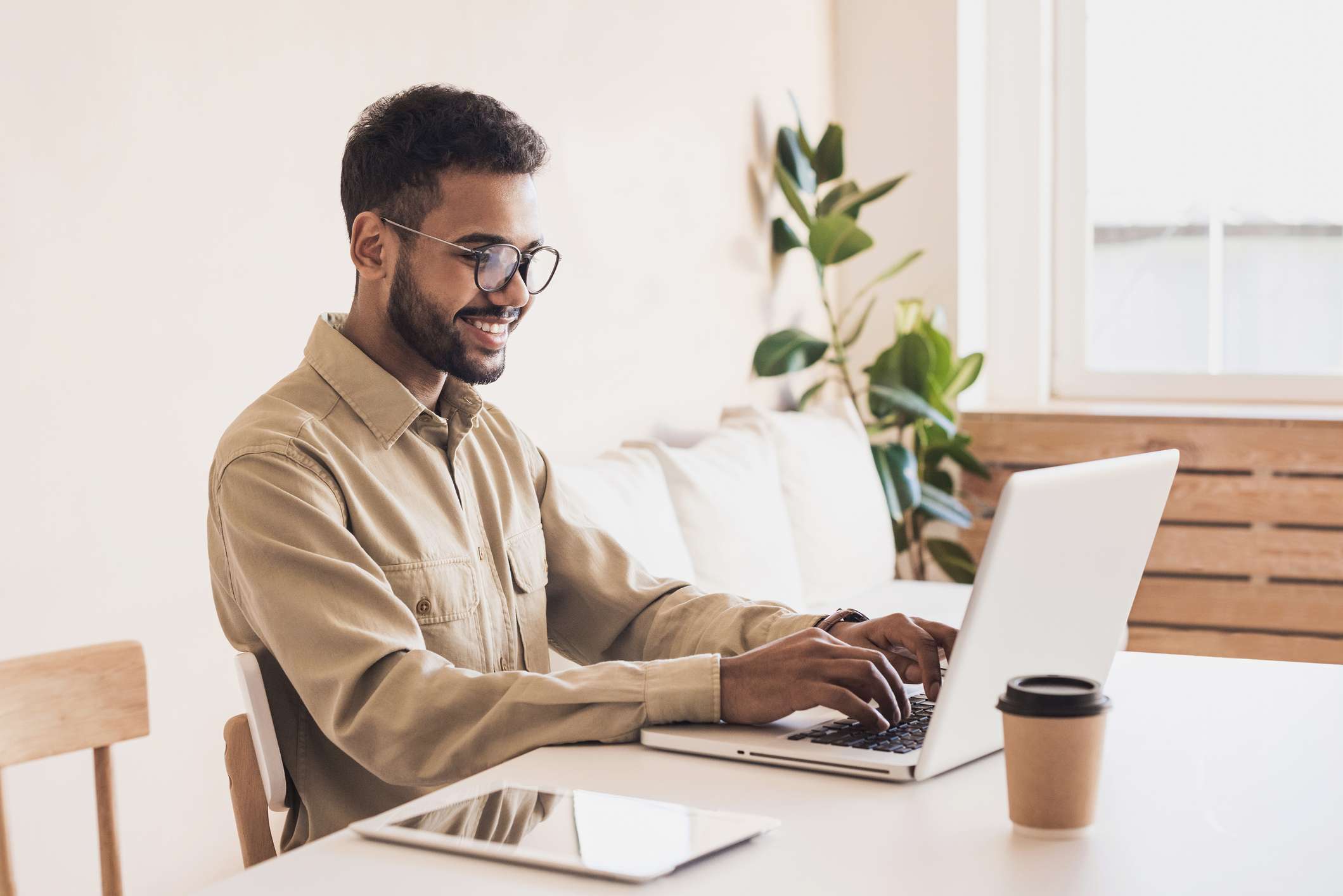 Business man typing on laptop computer