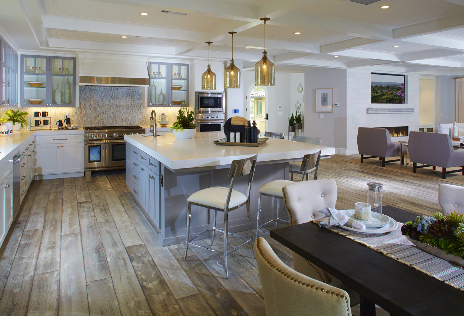 Modern kitchen by SummerHill Homes with stainless steel appliances, sleek cabinetry, and a stylish center island.